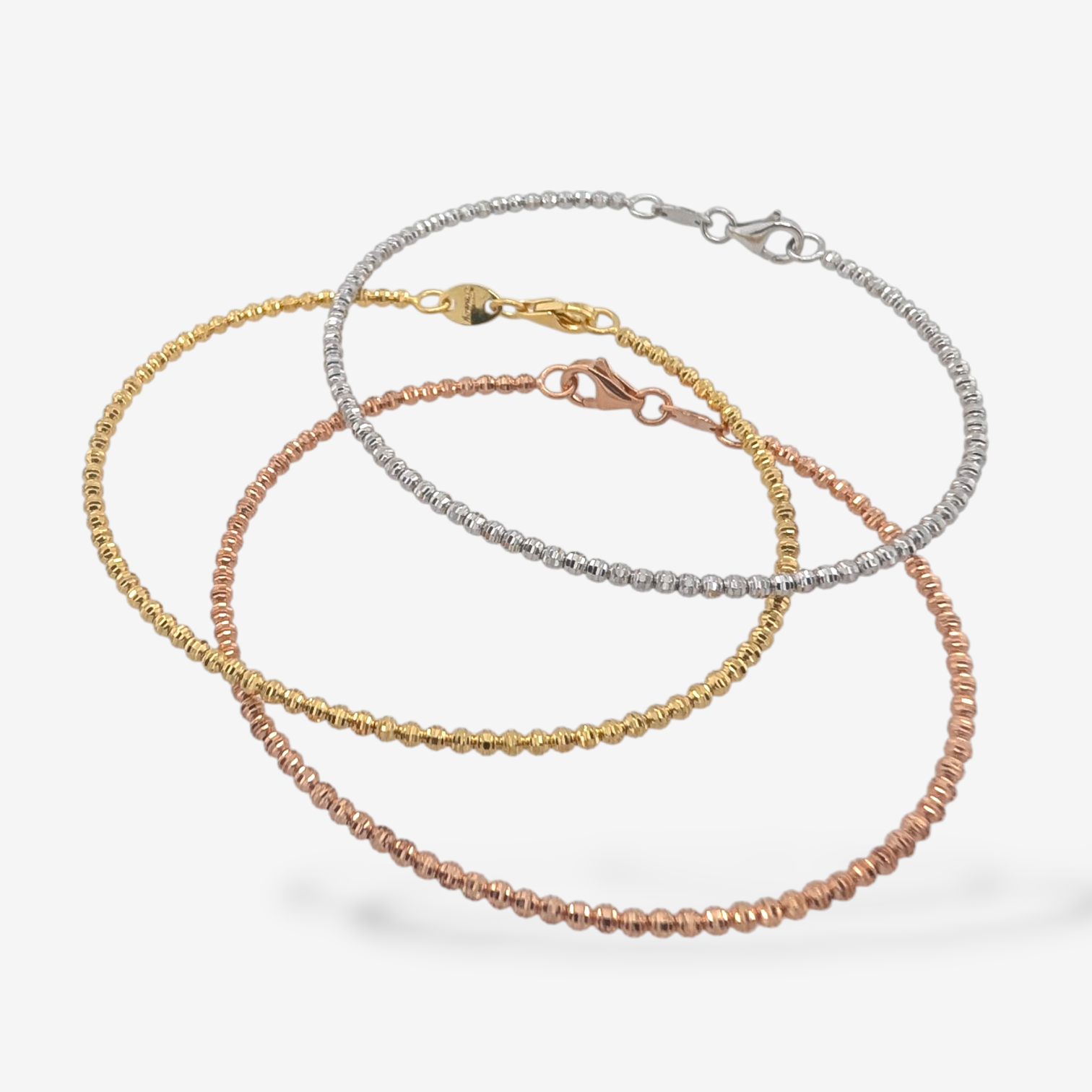 PXL_20250915_165052032.MP-11.png Set (#15) 3 Pulseras c/ Esferas Diamantadas (2 mm) c/ Cierre Lobster - Oro Tres Tonos 18Kts - Image 1