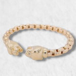 Pulsera Abierta Tejido Santos c/ Terminales Pantera - Oro Amarillo 14Kts