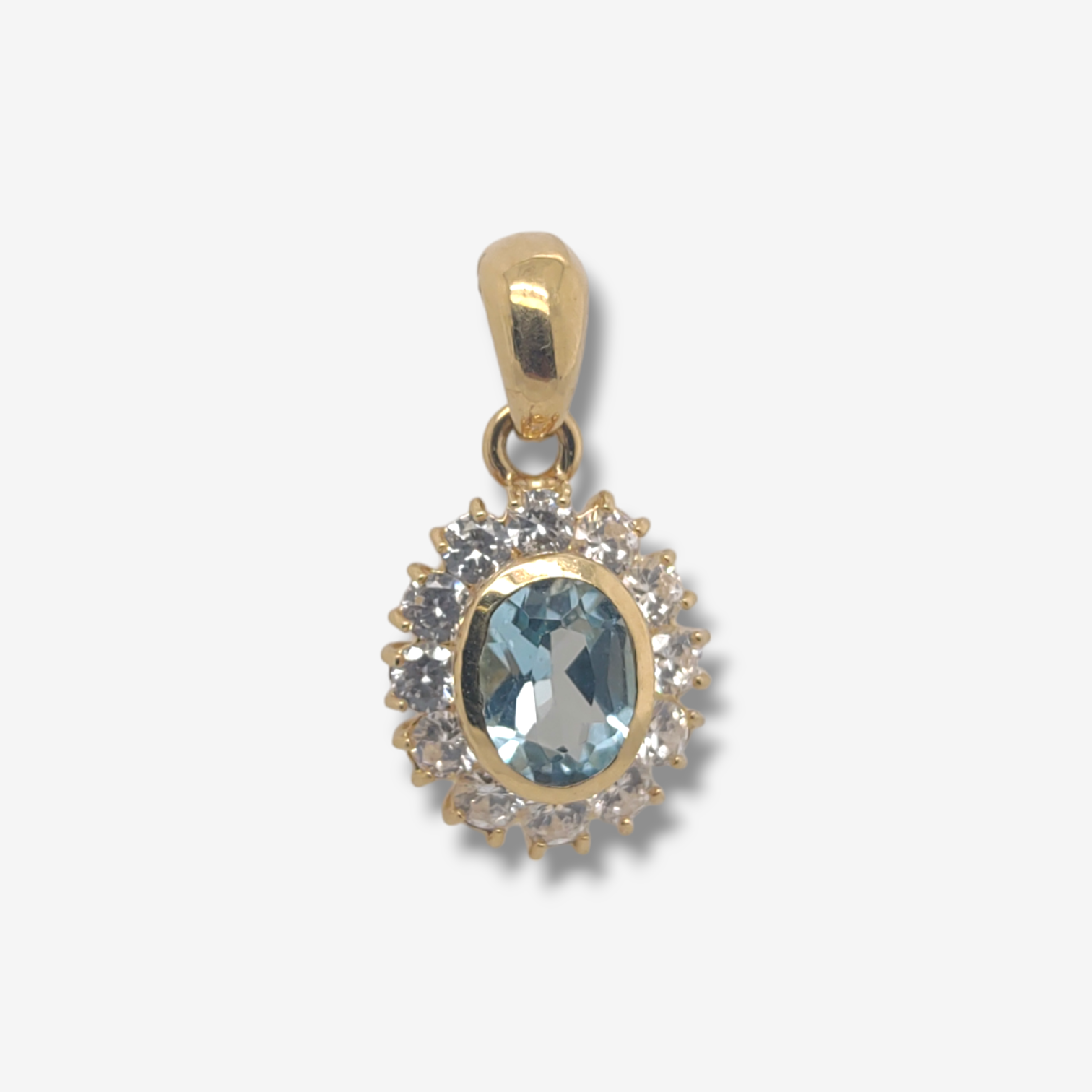 Photoroom-20240618_155034.png Dije (12 x 14 mm) Topacio Azul Ovalado c/ Halo Zircones Pave - Oro Amarillo 18Kts - Image 1